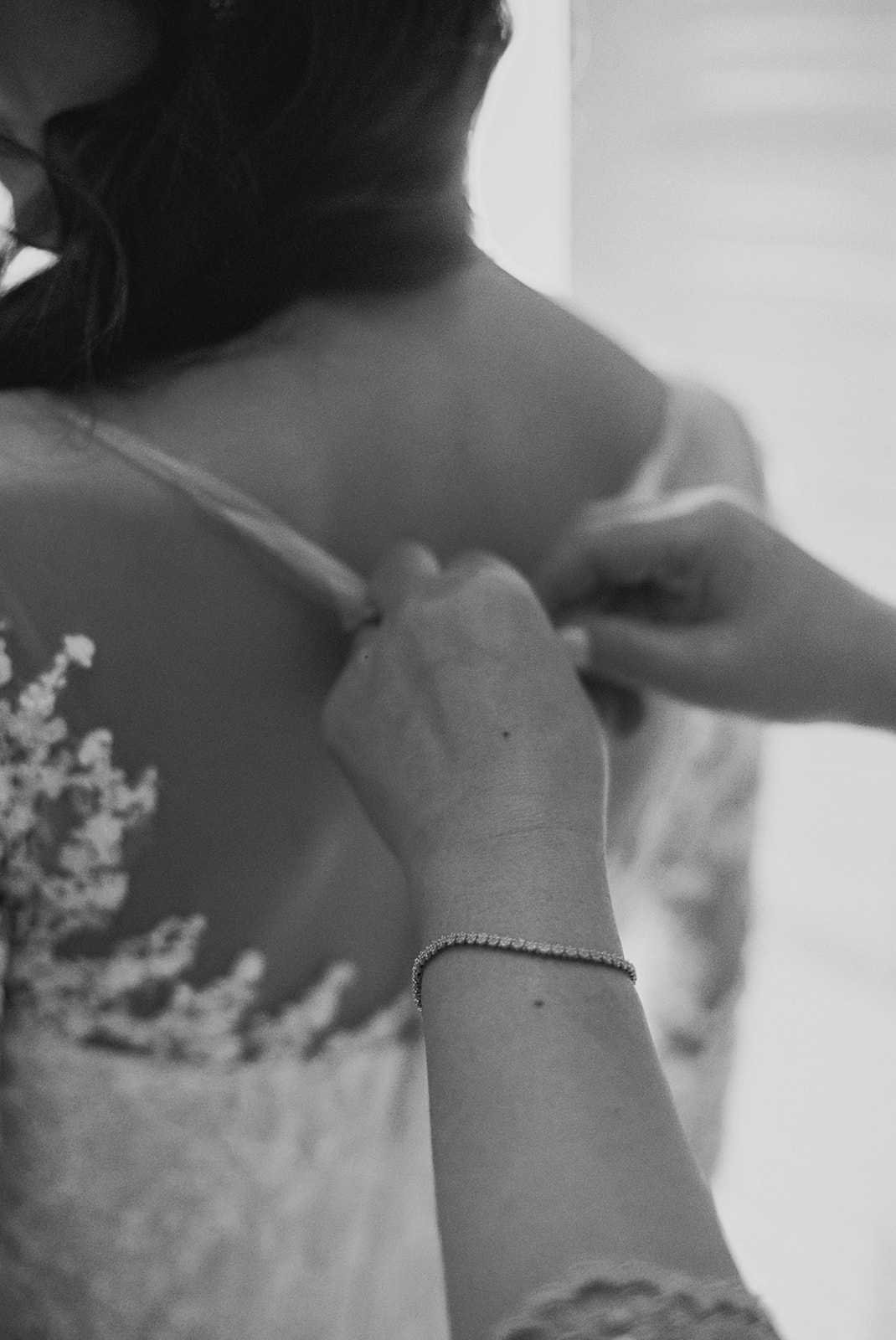 close up film portrait of bride getting dressed