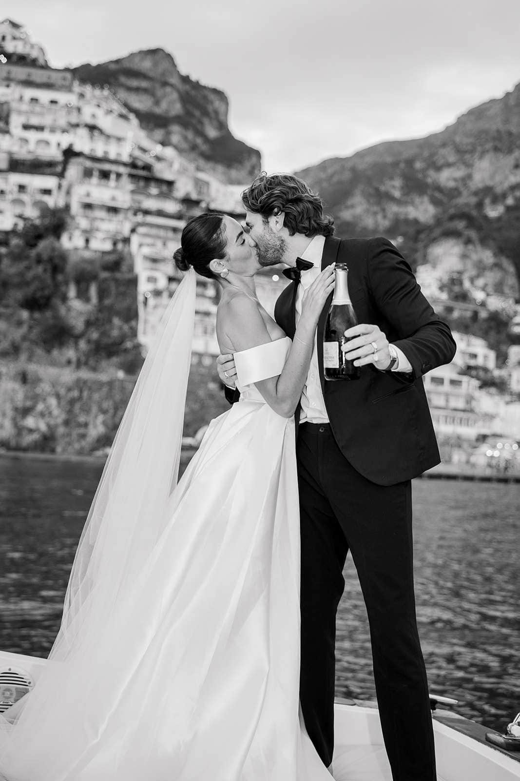 Amalfi wedding couple kissing on boat