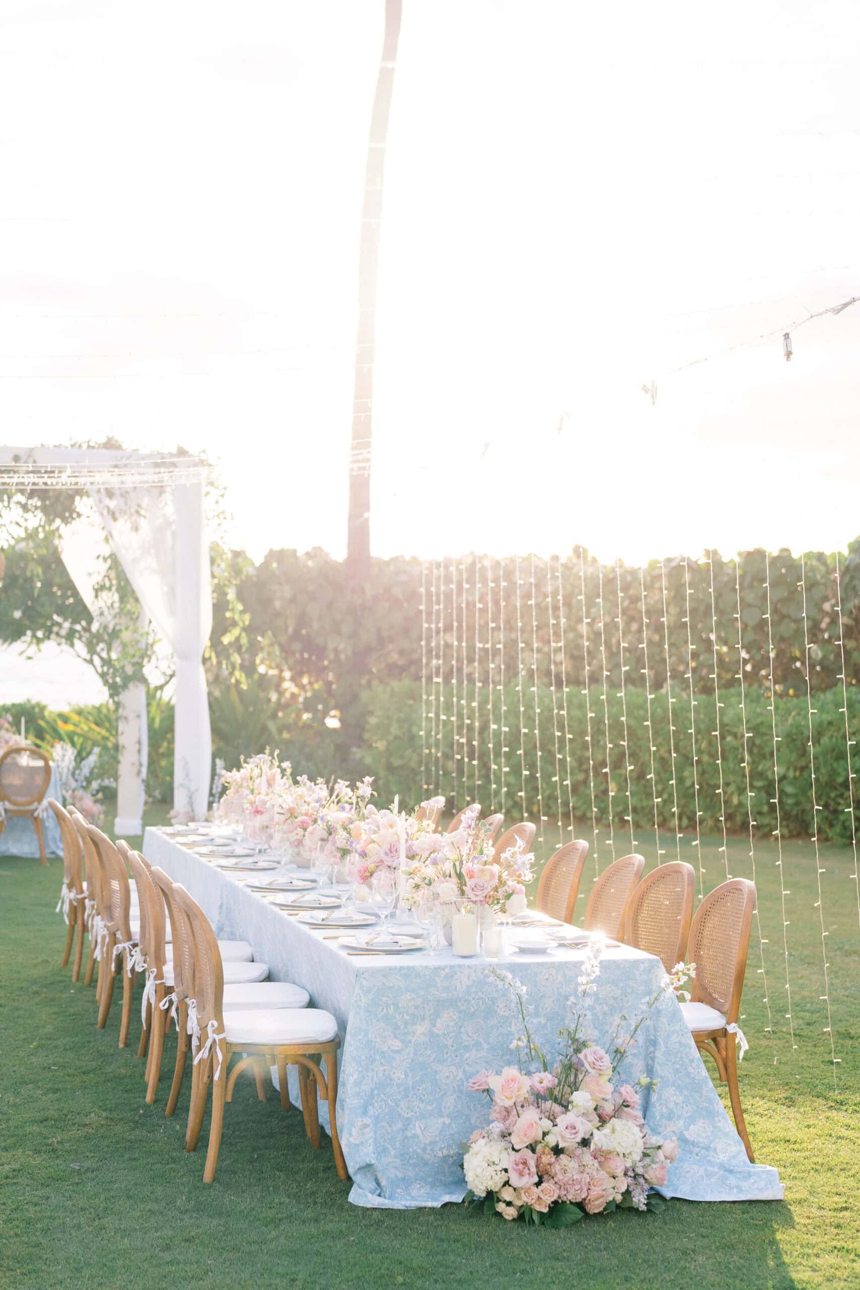 Hawaii wedding reception florals on the beach